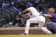 Chicago Cubs' Jake Arrieta lays down a sacrifice bunt, advancing Eric Sogard to second during the third inning of the team's baseball game against the New York Mets on Tuesday, April 20, 2021, in Chicago. (AP Photo/Charles Rex Arbogast)