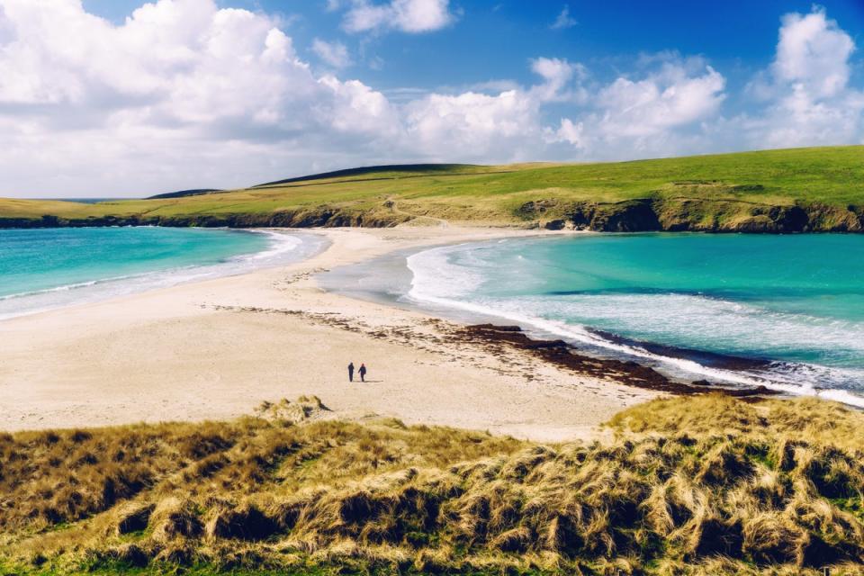 A tombolo sand bar connects St Ninian’s Island to the mainland (Getty Images)