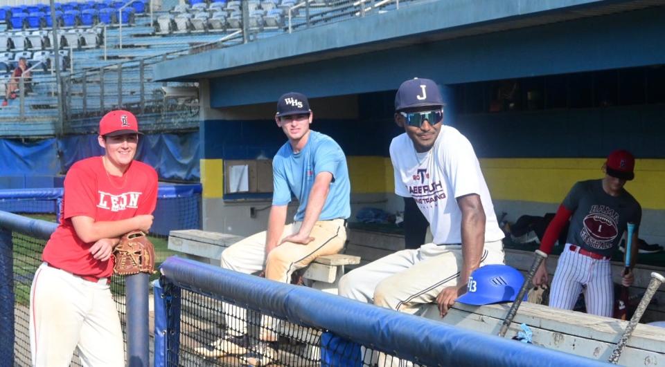 Leon’s Gus Parker (left), Wakulla’s Colby Zinser (middle), and Rickards/Jackson State’s Lawrence Steed (right) take a break during Post 13 baseball practice at Tallahassee Community College’s Eagle Field, June 8, 2022