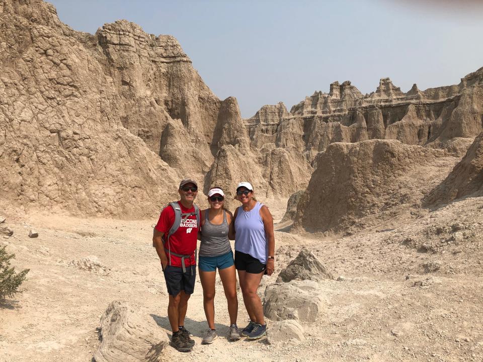 (From left) Scott, Lindsay and Laurie Dubin pose for a picture at Badlands National Park on their road trip to UW-Madison.