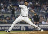 Sep 18, 2017; Bronx, NY, USA; New York Yankees pitcher Aroldis Chapman (54) pitches in the eighth inning against the Minnesota Twins at Yankee Stadium. Mandatory Credit: Wendell Cruz-USA TODAY Sports