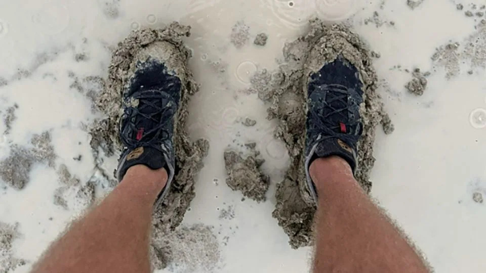 Heavy rain covered the ground with thick mud at Burning Man in Black Rock Desert. - Andrew Hyde