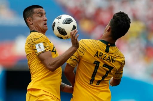 Tim Cahill with youngster Daniel Arzani - the veteran finally saw action at this World Cup but could not prevent Australia from going down 2-0 to Peru