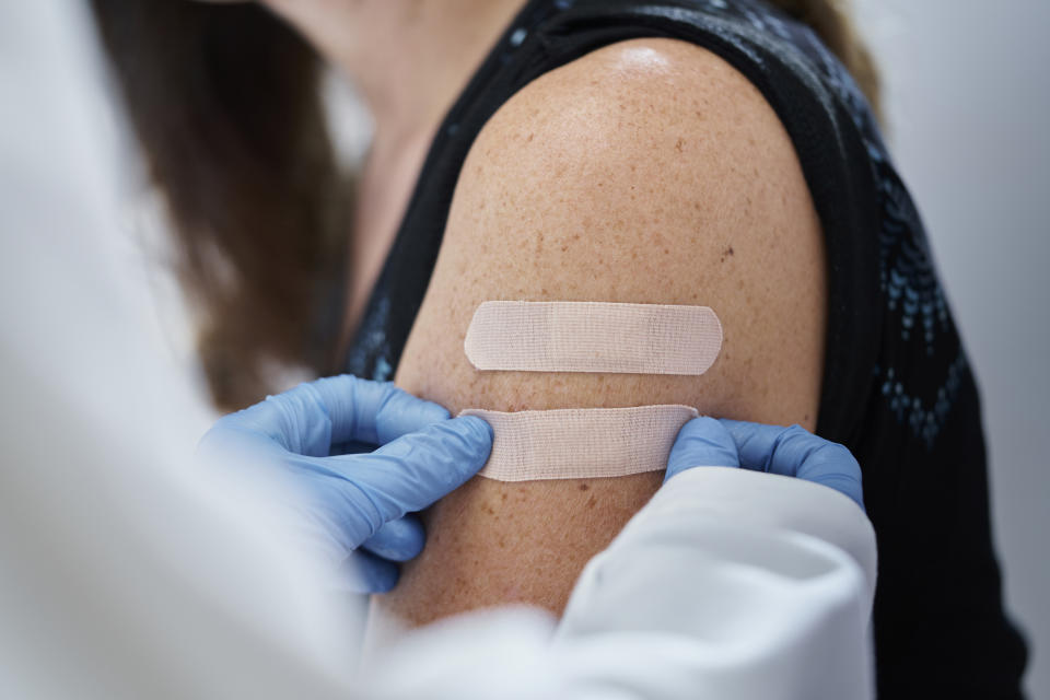 woman getting a vaccine. Measles, mumps and covid (Photo via Getty Images)