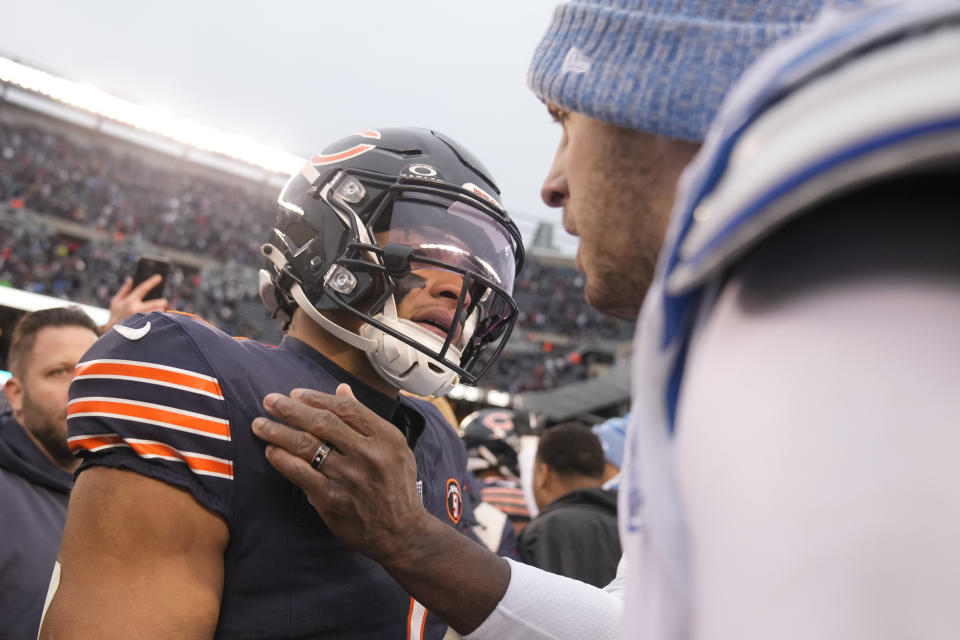 Chicago Bears quarterback Justin Fields, left, and Detroit Lions quarterback Jared Goff talk briefly after the Bears 28-13 win in an NFL football game Sunday, Dec. 10, 2023, in Chicago. (AP Photo/Erin Hooley)