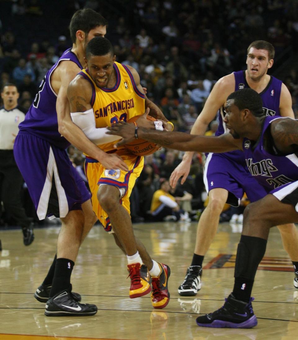 Donte Green moves through defense with a basketball.