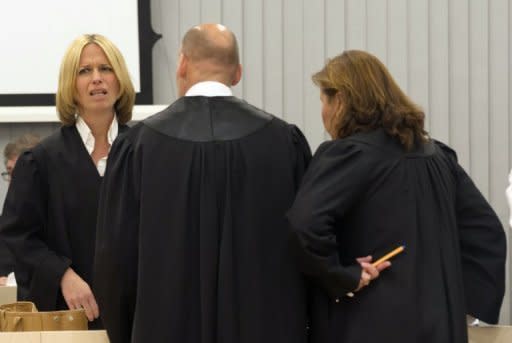 Norwegian prosecutor Inga Bejer Engh (left) speaks on Thursday with Geir Lippestad (centre) and Vibeke Hein Baera (right), lawyers for mass killer Anders Behring Breivik, before presenting closing arguments in Oslo