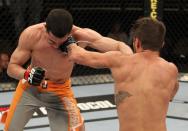 Josh Ferguson and Roland Delorme (right to left) exchange blows during The Ultimate Fighter 14 Finale at the Pearl Theatre at the Palms Hotel and Casino on December 3, 2011 in Las Vegas, Nevada. (Photo by Josh Hedges/Zuffa LLC/Zuffa LLC via Getty Images)