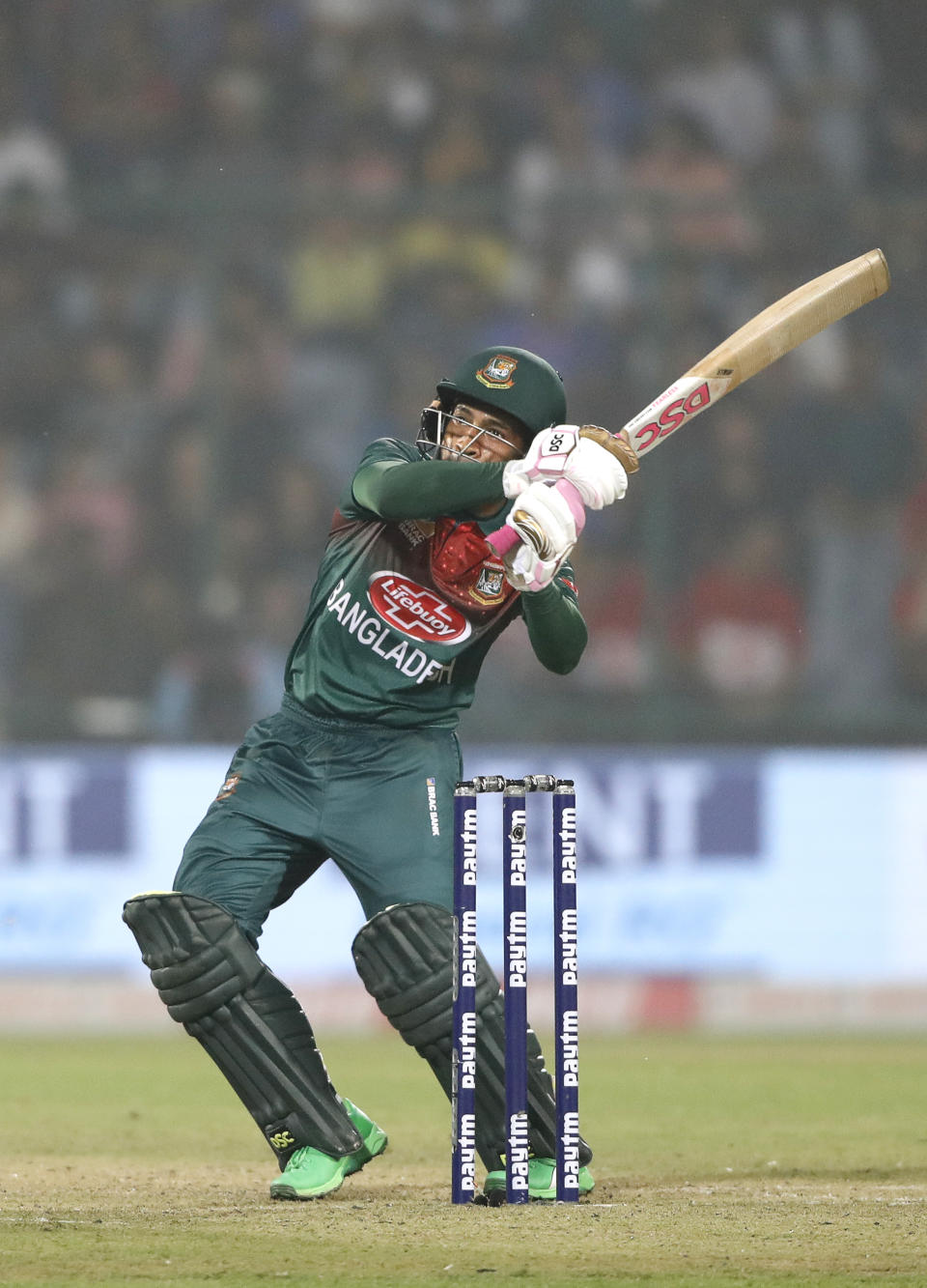 Bangladesh's Bangladesh's Mushfiqur Rahim hits a six against India during the first T20 cricket match at the Arun Jaitley stadium, in New Delhi, India, Sunday, Nov. 3, 2019. (AP Photo/Manish Swarup)