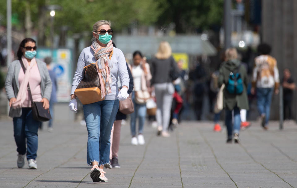 21 April 2020, Baden-Wuerttemberg, Stuttgart: Passers-by walk along Königstraße wearing face masks. Photo: Marijan Murat/dpa (Photo by Marijan Murat/picture alliance via Getty Images)
