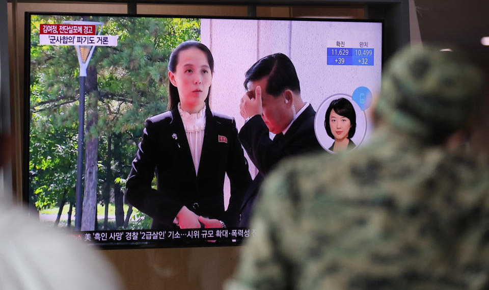 A man watches a TV screen showing a news program with a file image of Kim Yo Jong, the powerful sister of North Korea's leader Kim Jong Un, at the Seoul Railway Station in Seoul, South Korea, Thursday, June 4, 2020. North Korea threatened on Thursday to end an inter-Korean military agreement reached in 2018 to reduce tensions if the South fails to prevent activists from flying anti-Pyongyang leaflets over the border. (AP Photo/Lee Jin-man)