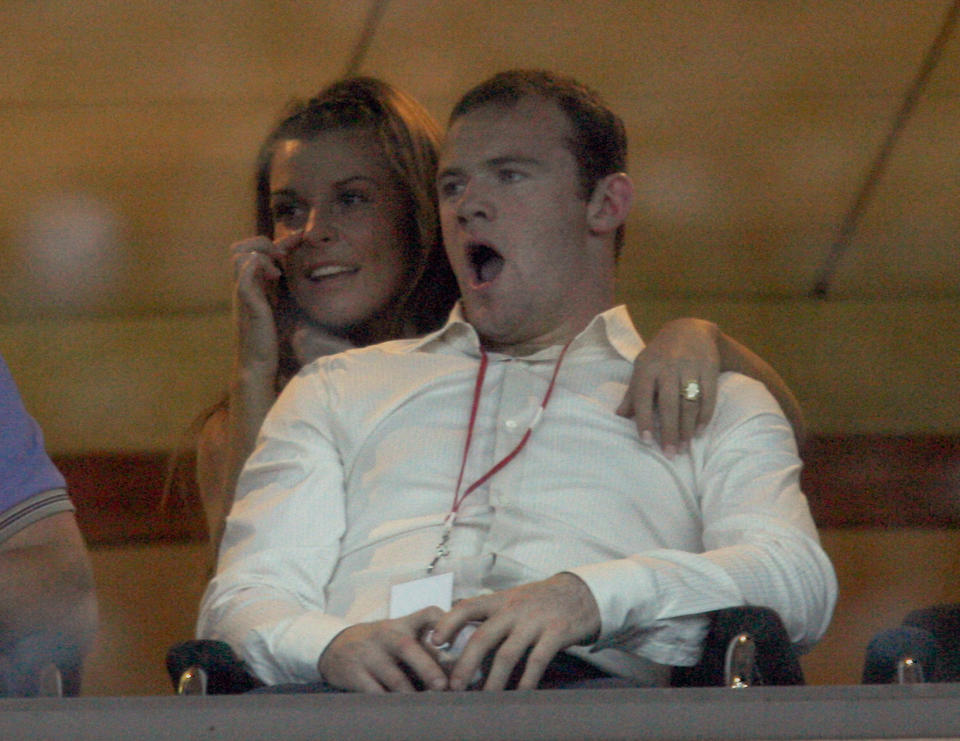 Manchester United soccer player Wayne Rooney and fiancee Coleen McLoughlin watch the Liverpool Sound concert at Anfield stadium in Liverpool, northern England, June 1, 2008. REUTERS/Nigel Roddis (BRITAIN)