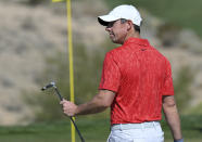 Rory McIlroy, of Northern Ireland, acknowledges the spectators after a putt on the third hole during final round of the CJ Cup golf tournament, Sunday, Oct. 17, 2021, in Las Vegas. (AP Photo/David Becker)