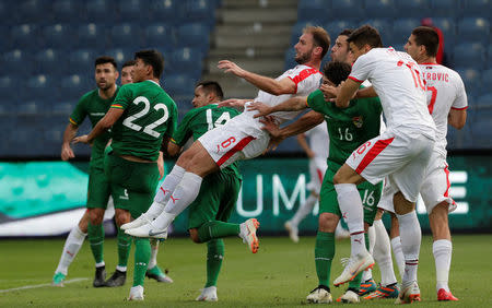 Soccer Football - International Friendly - Serbia vs Bolivia - Merkur-Arena, Graz, Austria - June 9, 2018 Serbia's Branislav Ivanovic in action with Bolivia's Leonel Justiniano and Jose Segredo REUTERS/Heinz-Peter Bader