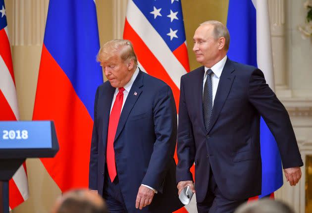 Then-President Donald Trump and Russian President Vladimir Putin arrive to attend a joint press conference after a meeting at the Presidential Palace in Helsinki, on July 16, 2018. (Photo: YURI KADOBNOV via Getty Images)