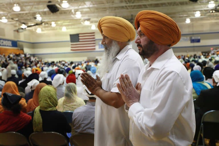 Family and friends and community members gather at Oak Creek High School to mourn the loss of six members of the Sikh Temple of Wisconsin on August 10, 2012 in Oak Creek, Wisconsin