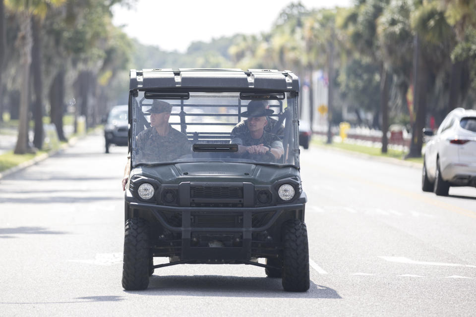 U.S. Marine Brig. Gen. Walker Field, left, rides in a cart with Sgt. Maj. Sael Garcia near the parade deck at the Marine Corps Recruit Depot, Wednesday, June 28, 2023, in Parris Island, S.C. (AP Photo/Stephen B. Morton)