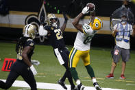 Green Bay Packers tight end Marcedes Lewis (89) pulls in a touchdown reception in front of New Orleans Saints strong safety Malcolm Jenkins (27) in the second half of an NFL football game in New Orleans, Sunday, Sept. 27, 2020. (AP Photo/Butch Dill)