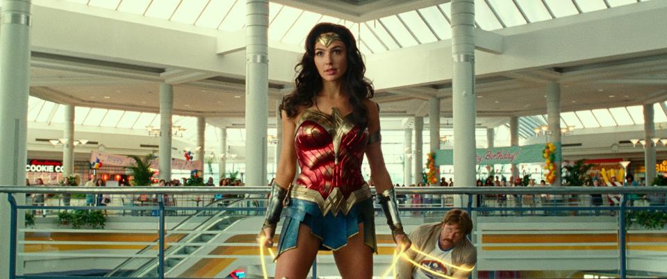 Wonder Woman (Gal Gadot) takes out a crew of bad guys and foils a jewelry heist at a mall in "Wonder Woman 1984."