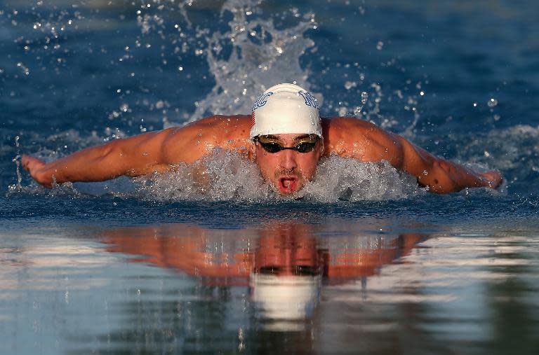 Michael Phelps competes in the Men's 100m Butterfly final during day one of the Arena Grand Prix at the Skyline Aquatic Center on April 24, 2014 in Mesa, Arizona