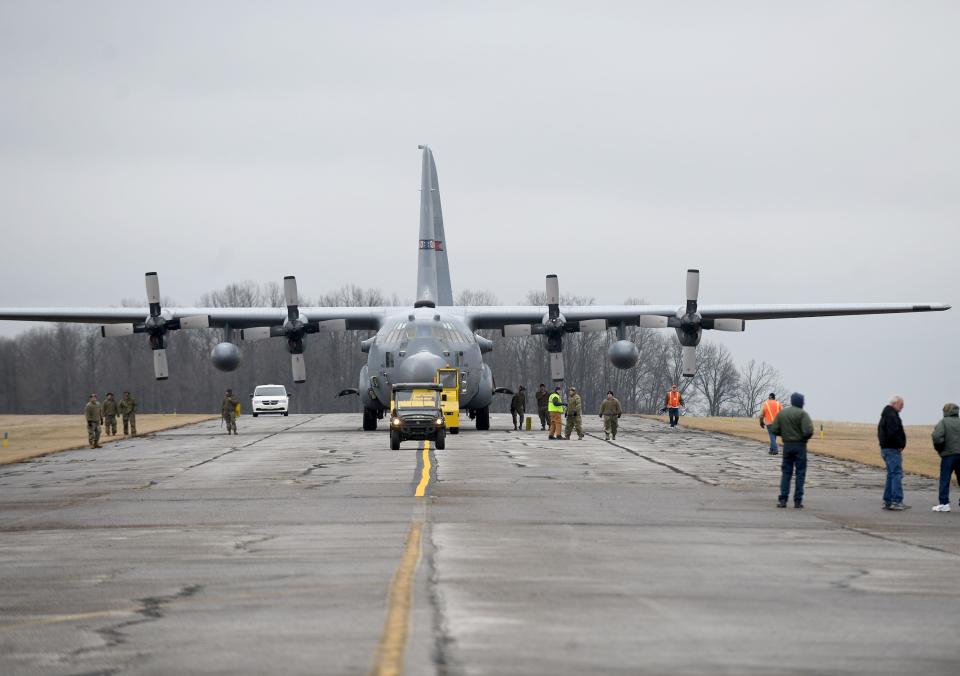 A C-130H Hercules Air Force combat cargo aircraft, with the guidance from Mansfield Ohio Air National Guard 179th Airlift Wing, makes its way Saturday to the MAPS Air Museum in Green.