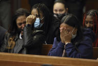 Tamala Payne, left, the mother of Casey Goodson Jr., reacts along with Goodson's aunt Brandie Payne during the reading of the statement of facts during the arraignment of former Franklin County, Ohio, deputy Jason Meade in Columbus, Ohio, Friday, Dec. 3, 2021. Meade, who fatally shot Casey Goodson Jr. in the back five times has pleaded not guilty to charges of murder and reckless homicide. (AP Photo/Paul Vernon)