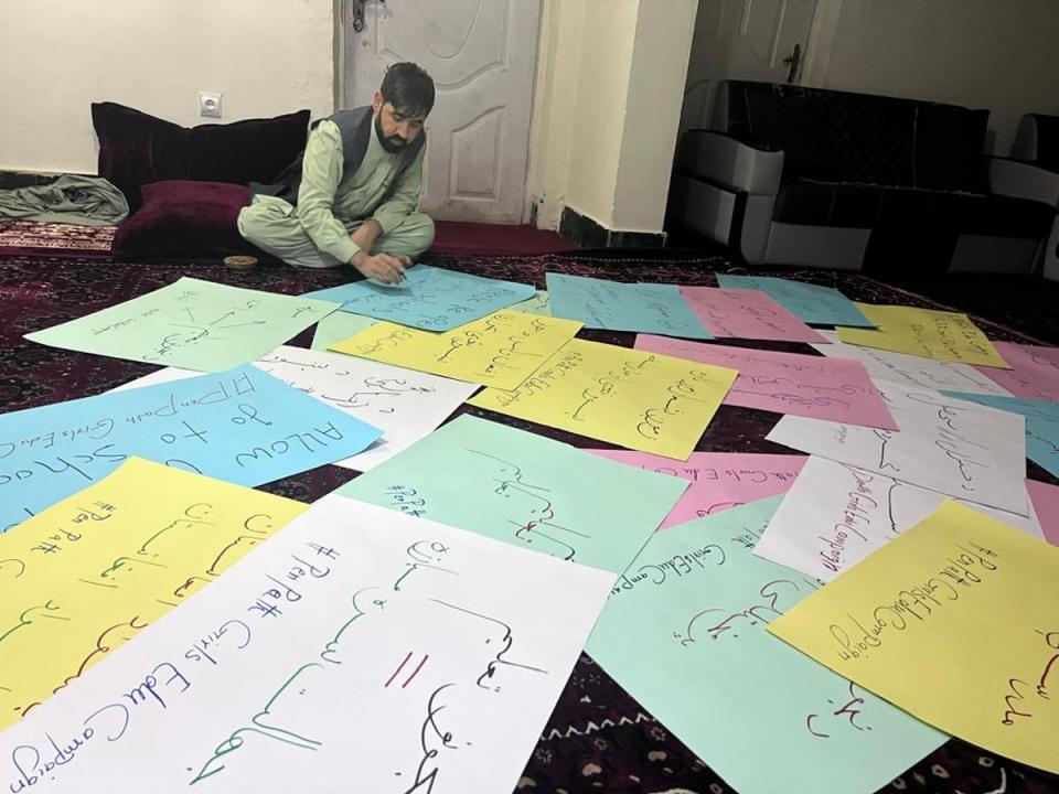 The activist preparing posters for his girls’ education campaign in Afghanistan (Sourced: The Independent)