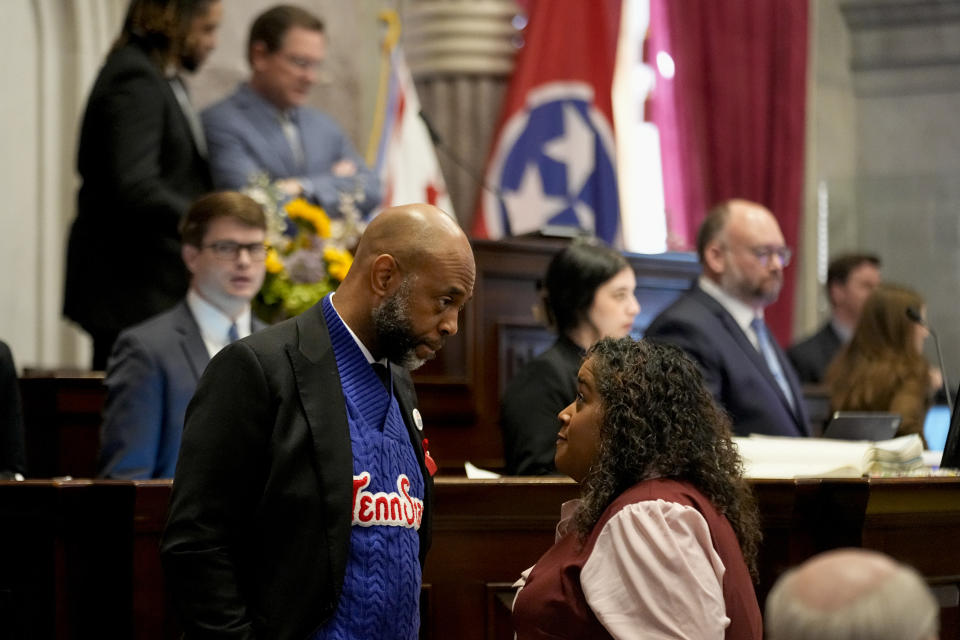 State Rep. Harold Love, Jr., D-Nashville, left, speaks to state Sen. Raumesh Akbari, D-Memphis, on the House floor Thursday, March 28, 2024, in Nashville, Tenn. (AP Photo/George Walker IV)