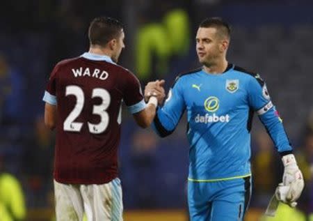 Britain Football Soccer - Burnley v Watford - Premier League - Turf Moor - 26/9/16 Burnley's Tom Heaton shakes hands with Burnley's Stephen Ward Action Images via Reuters / Jason Cairnduff