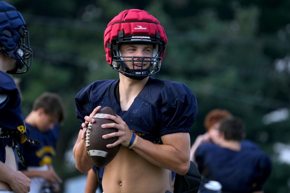 Barrington quarterback Alex McClelland performs a drill during practice earlier this month.