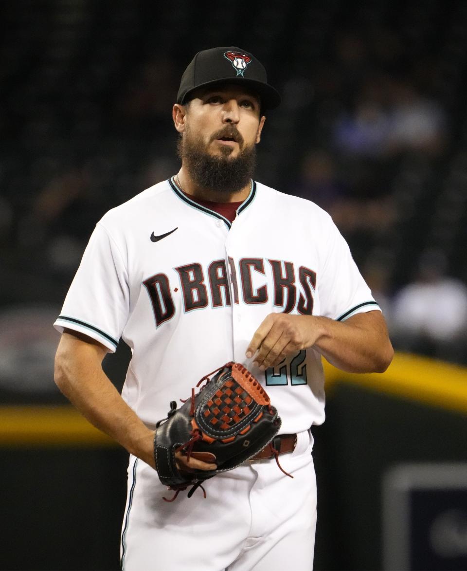 May 26, 2022; Phoenix, Arizona, USA; Arizona Diamondbacks reliever Caleb Smith (22) reacts after Los Angeles Dodgers Chris Taylor (3) hit a two-run, home run in the eighth inning at Chase Field.