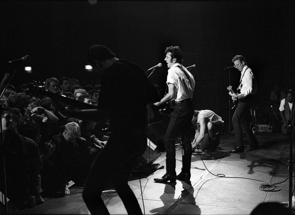 Schloss (far right) with Joe Strummer and bassist Jim Monica performing with rock group The Latino Rockabilly War, at London’s Fountain Leisure Centre, July 9, 1988. (Credit: Julian Yewdall/Getty Images)