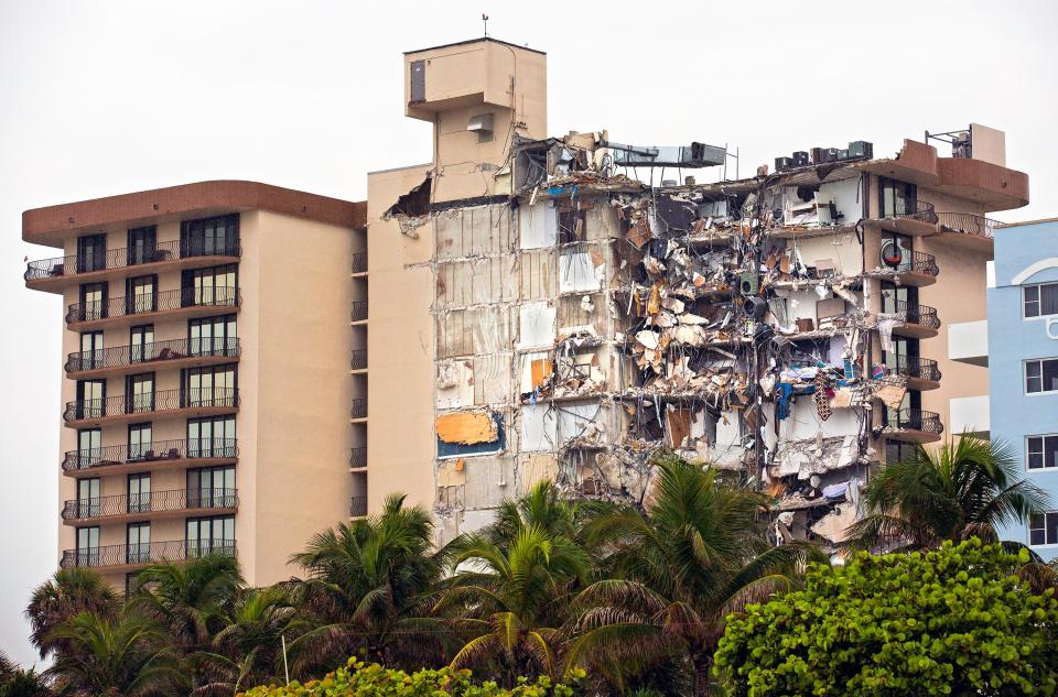 The partially collapsed Champlain Towers South condo is pictured in Surfside, Florida. Families wait to hear news about their loved ones as rescue efforts continued late Thursday