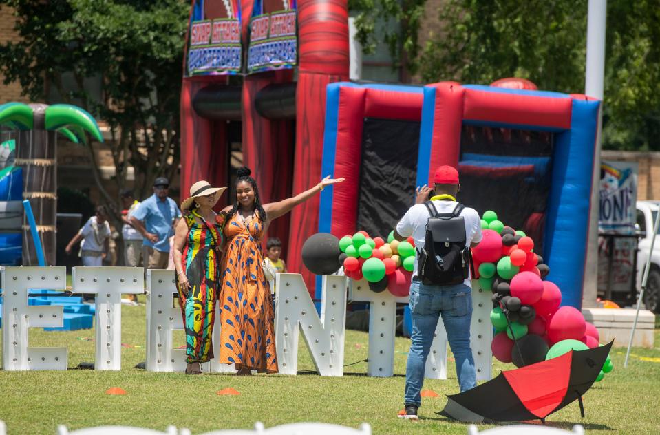 Visitors check out the festivities during Juneteenth A Family Reunion For The Culture at Museum Plaza Saturday, June 18, 2022. The celebration included, live music, food, games and more.