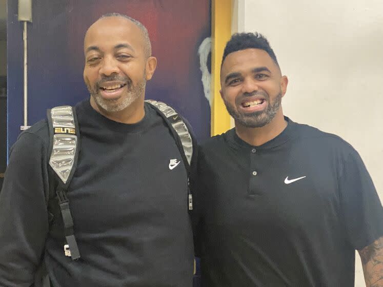 Taft coach Derrick Taylor with Birmingham coach Nick Halic. Both graduated from their respective schools.