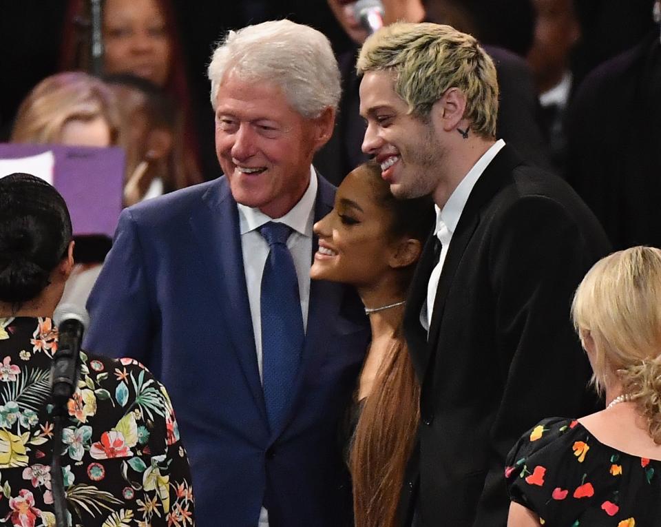 Former US President Bill Clinton takes a picture with singer Ariana Grande and her fiancee Pete Davidson at Aretha Franklin's funeral at Greater Grace Temple on August 31, 2018 in Detroit, Michigan.