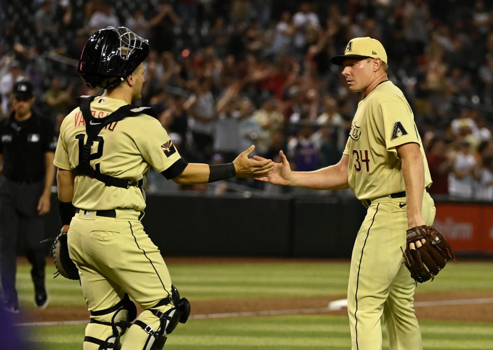 Daulton Varsho #12 and Mark Melancon #34 of the Arizona Diamondbacks have fantasy value