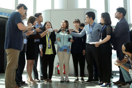 Chung Yoo-ra, the 21-year-old daughter of Choi Soon-sil, answers questions from the press after arriving at the Incheon International Airport in Incheon, South Korea, May 31, 2017. REUTERS/Chung Sung-Jun/Pool