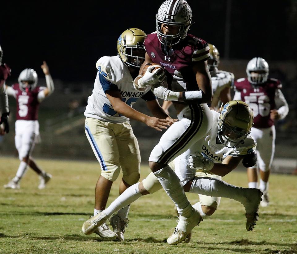 Mt. Whitney's Israel Briggs scampers in for a touchdown against Monache during their high school football game at the Mineral King Bowl in Visalia, Calif., Friday, Oct. 20, 2023.