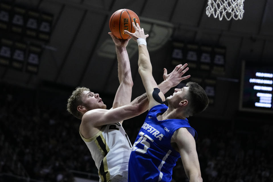 Purdue forward Caleb Furst (1) shoots over Hofstra guard German Plotnikov (25) during the second half of an NCAA college basketball game in West Lafayette, Ind., Wednesday, Dec. 7, 2022. (AP Photo/Michael Conroy)