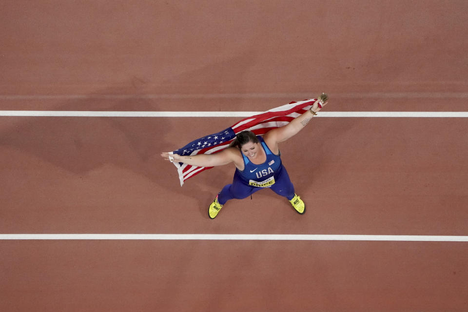 Deanna Price, of the United States, celebrates winning the gold medal for the women's hammer throw at the World Athletics Championships in Doha, Qatar, Saturday, Sept. 28, 2019. (AP Photo/Morry Gash)