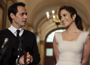 Actress Jennifer Lopez and her husband singer Marc Anthony face reporters before a meeting with Speaker of the U.S. House of Representatives Nancy Pelosi to discuss education in the Latino community and the historic college affordability legislation the House will consider this week on Capitol Hill in Washington, September 16, 2009. REUTERS/Yuri Gripas (UNITED STATES POLITICS ENTERTAINMENT)