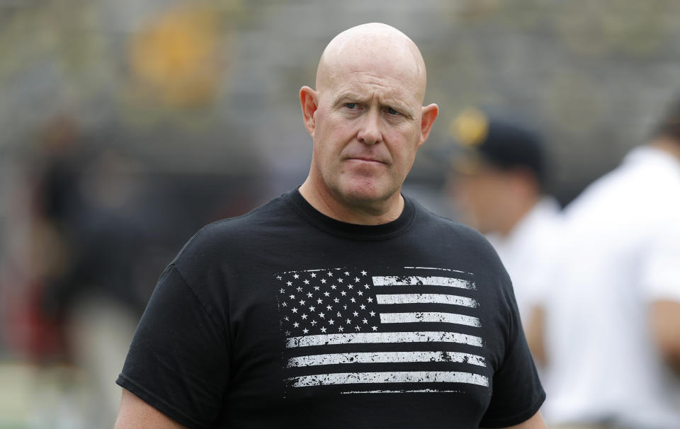 FILE - In this Sept. 1, 2018, file photo, Iowa strength and conditioning coach Chris Doyle walks on the field before an NCAA college football game between Iowa and Northern Illinois, in Iowa City, Iowa. Former players have accused Doyle of bullying and making racist comments. He remains on paid administrative leave, The Associated Press reports, Friday, June 12, 2020. (AP Photo/Charlie Neibergall, File)