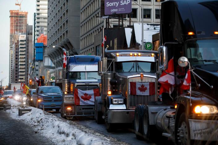 Trucks line streets in Toronto on Feb. 5, 2022. A convoy of truckers and supporters have occupied downtown Ottawa since last Saturday in protest of Canada&#39;s COVID-19 vaccine mandate, with convoys branching out to other major cities such as Toronto this weekend.