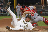 <p>Pittsburgh Pirates’ John Jaso (28) slides safely past Washington Nationals catcher Jose Lobaton to score the second of two runs on a single by Andrew McCutchen during the seventh inning of a baseball game in Pittsburgh, May 17, 2017. The Pirates won 6-1. (Photo: Gene J. Puskar/AP) </p>