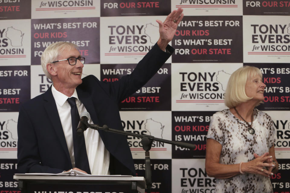 Tony Evers, with his wife, Kathy, speaks after his win in Wisconsin's Democratic gubernatorial primary election during an event at Best Western Premier Park Hotel in Madison, Wis., Tuesday, Aug. 14, 2018. (Amber Arnold/Wisconsin State Journal via AP)