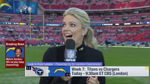 Reporter gets hit in the head with football on live TV, styles it