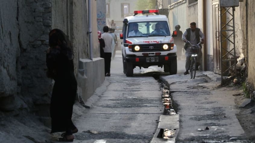 An ambulance in Kabul drives to the scene of an explosion.