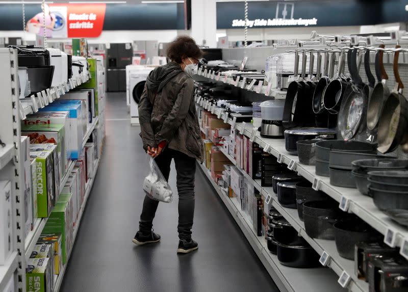 FILE PHOTO: A woman shops at consumer electronics retailer Media Markt in Budapest