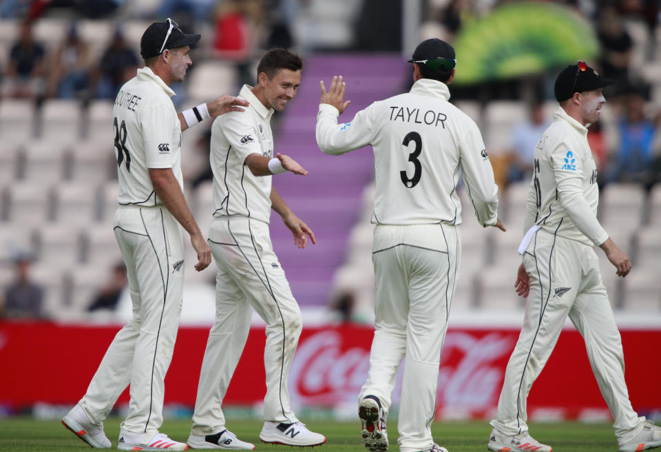 New Zealand's Trent Boult, second left, celebrates with teammates the dismissal of India's Ravindra Jadeja during the third day of the World Test Championship final cricket match between New Zealand and India, at the Rose Bowl in Southampton, England, Sunday, June 20, 2021. (AP Photo/Ian Walton)